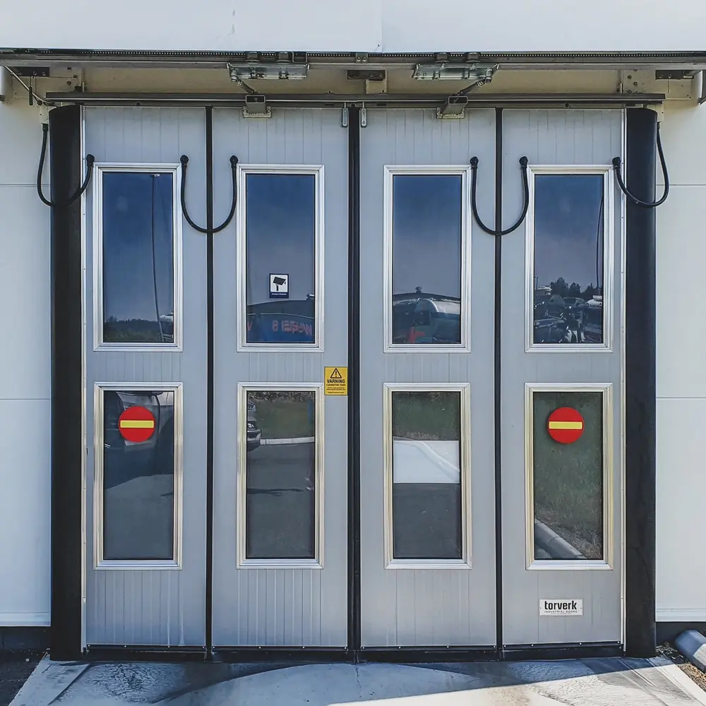 Folding door with wash bay surface treatment